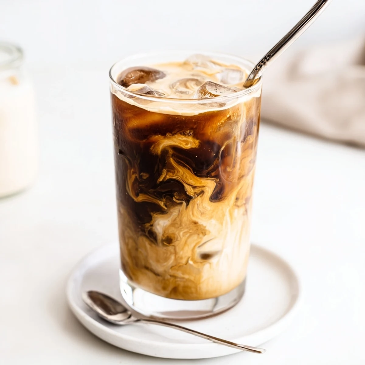 Rich and nutty Tahini Iced Coffee served in tall glasses, ideal for refreshing breaks.  