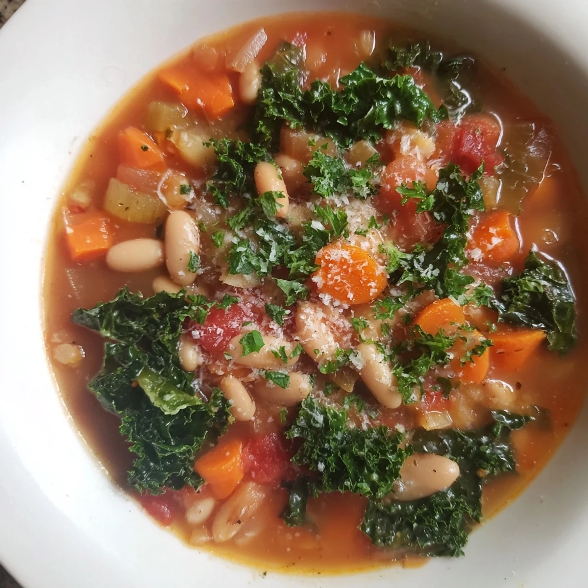 A satisfying bowl of Italian Bean & Kale Stew: a vegetarian delight with beans and tender kale.
