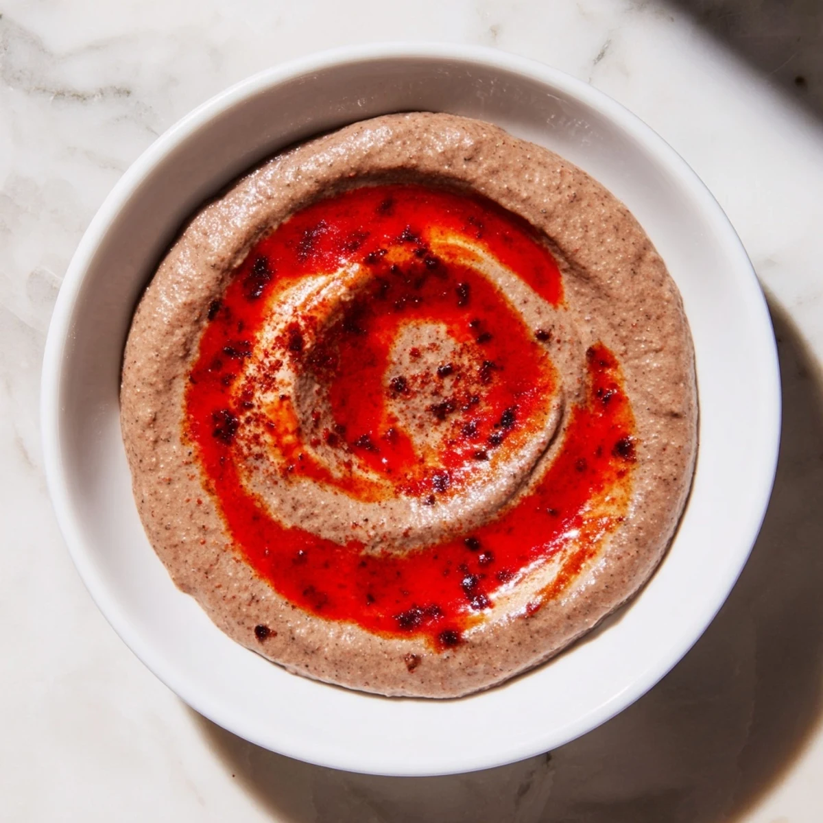 Creamy, vibrant Spicy Black Bean Dip is ready to serve with crispy tortilla chips, a great appetizer.