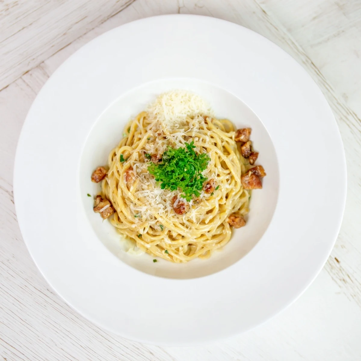 Creamy Carbonara Ramen fusion with perfectly coated noodles, ready in just fifteen minutes.