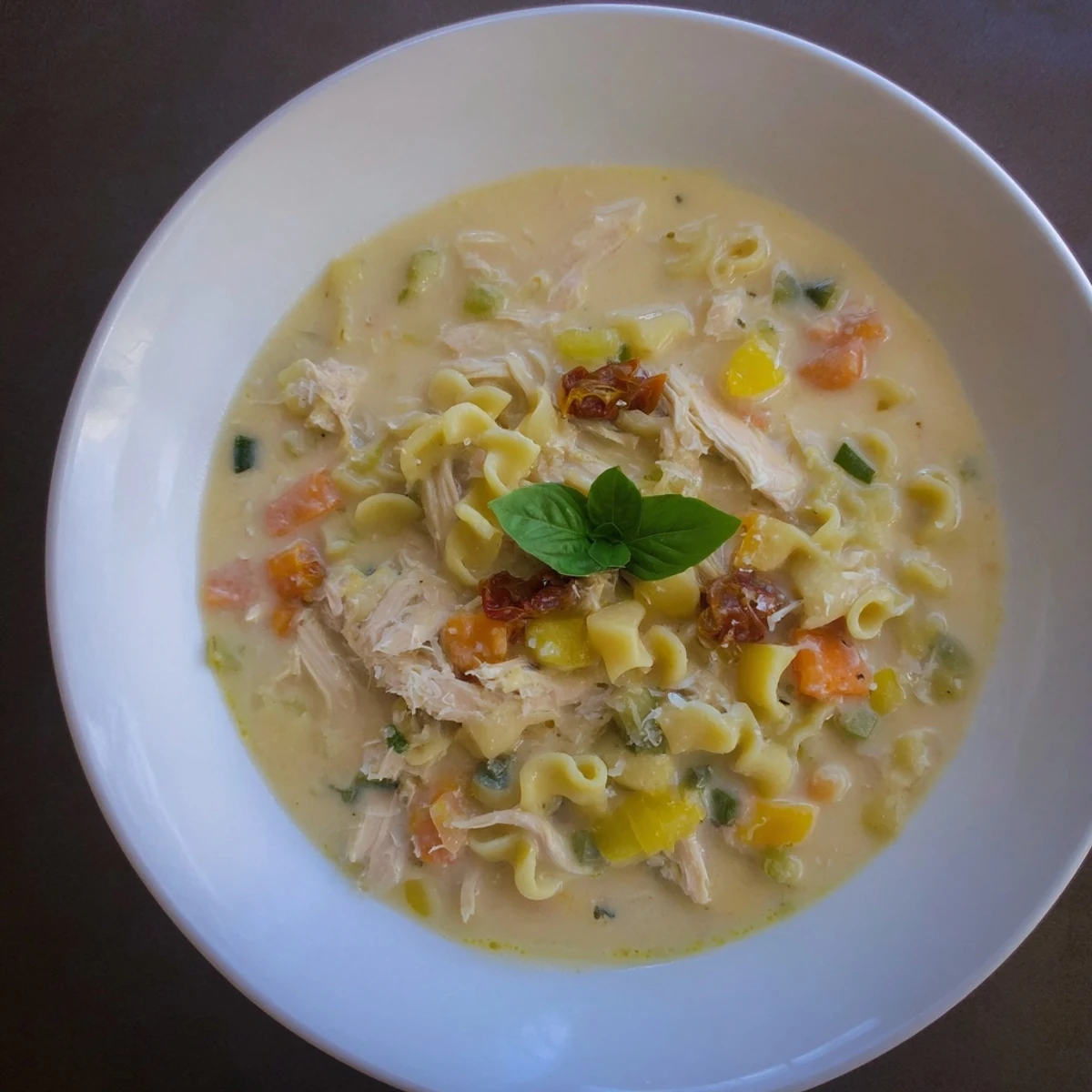 Creamy Marry Me Chicken Soup with shredded chicken, pasta, and sun-dried tomatoes—a delicious Italian-American dish.