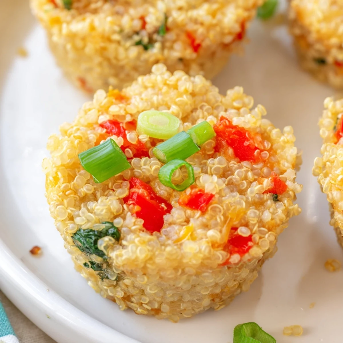 Golden brown baked cheddar quinoa bites, a delicious and cheesy, gluten-free snack idea.