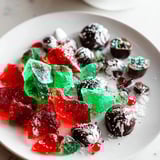 Vibrant Jingle Bell Rock Candy Display, speckled with sparkling sugar, offers holiday dessert inspiration.
