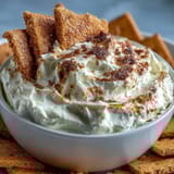 Sweet and smooth 3-ingredient cheesecake dip served with crunchy graham cracker pieces for dunking.