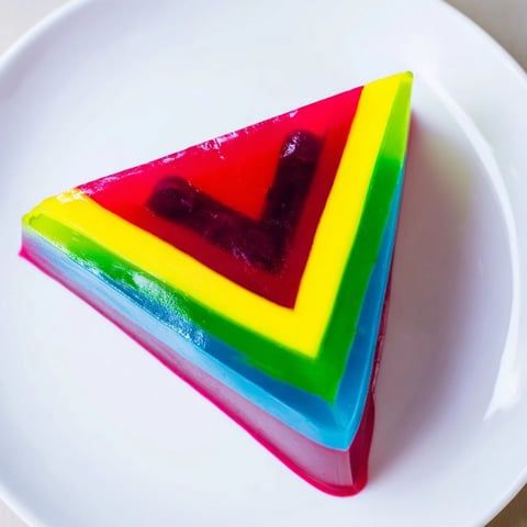 Vibrant slices of The Kaleidoscope dessert, a colorful, layered dessert perfect for a party.