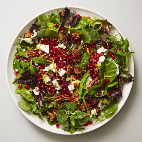 Freshly tossed Pomegranate Feta Wreath Salad, a stunning vegetarian appetizer for any gathering.