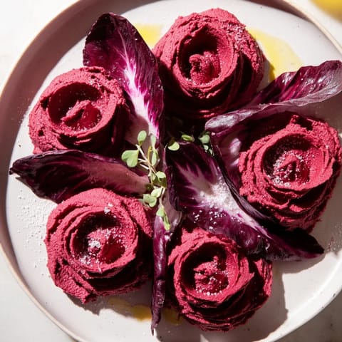 The Velvet Rose: creamy, crimson beet hummus swirled beautifully, garnished with microgreens, ready to serve.
