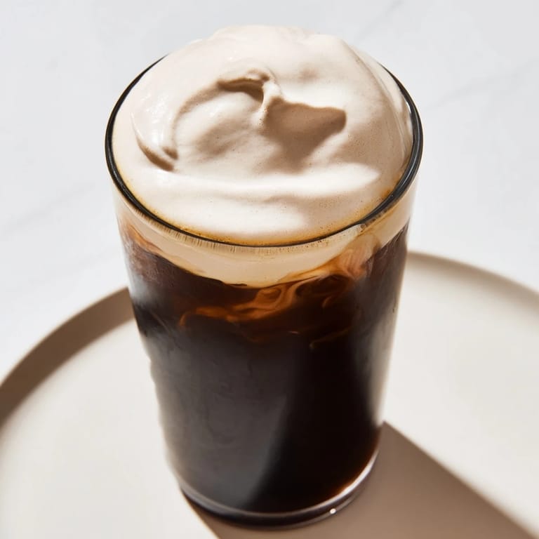 Homemade Starbucks Cold Foam with a light vanilla scent, ready to elevate any chilled beverage.